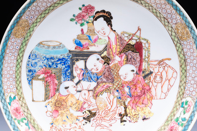 A fine Chinese famille rose eggshell plate with a lady and playing boys, Yongzheng