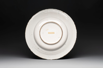 A large blue and white 'landscape and figures' dish, Frankfurt, 17th C.