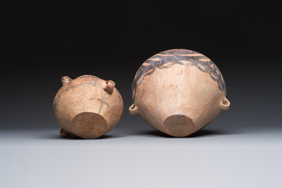A Chinese painted pottery pouring vessel and a jar with geometric design, Neolithic period, Majiayao culture, 3rd millennium B.C.
