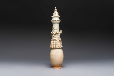 A large Chinese qingbai covered urn applied with immortals and a dragon, Northern Song