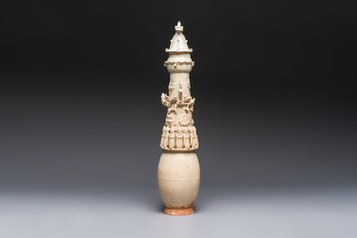 A large Chinese qingbai covered urn applied with immortals and a dragon, Northern Song