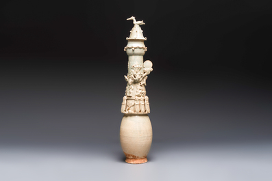 A large Chinese qingbai covered urn applied with immortals and a dragon, Northern Song