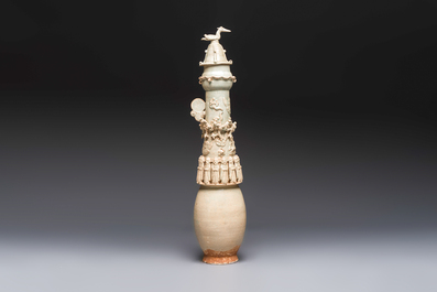 A large Chinese qingbai covered urn applied with immortals and a dragon, Northern Song