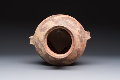 A Chinese painted pottery jar with handles, Late Bronze Age, Xindian culture, 13/10th C. B.C.