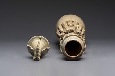 A large Chinese qingbai covered urn applied with immortals and a dragon, Northern Song