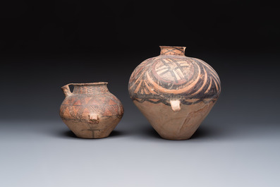 A Chinese painted pottery pouring vessel and a jar with geometric design, Neolithic period, Majiayao culture, 3rd millennium B.C.