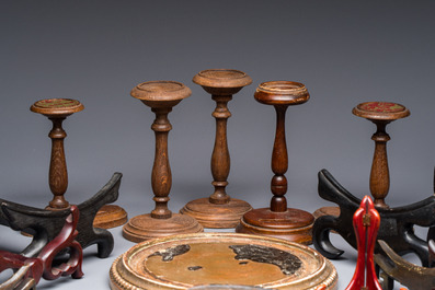 A collection of 21 wooden stands, 20th C.
