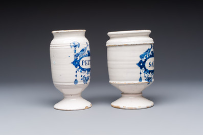 Five blue and white Dutch Delft and Brussels faience drug jars, 18th C.