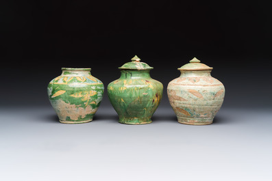 Three Chinese sancai-glazed pottery jars, two with cover, Ming or earlier