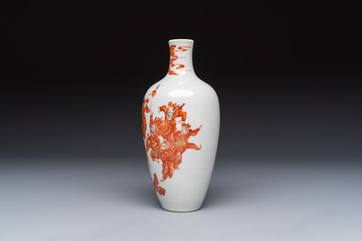 A Chinese iron-red and gilt-decorated vase with a narrative design, Qianlong mark, 19th C.