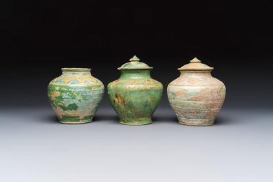Three Chinese sancai-glazed pottery jars, two with cover, Ming or earlier