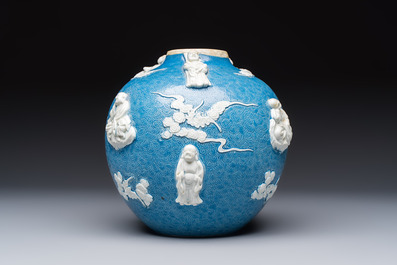 A Chinese sgraffiato blue-ground 'Luohan' vase with relief design, 19th C.