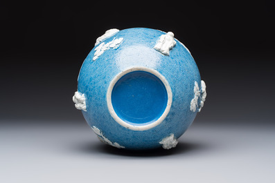 A Chinese sgraffiato blue-ground 'Luohan' vase with relief design, 19th C.