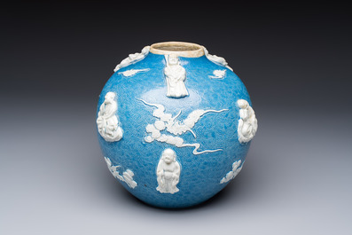 A Chinese sgraffiato blue-ground 'Luohan' vase with relief design, 19th C.