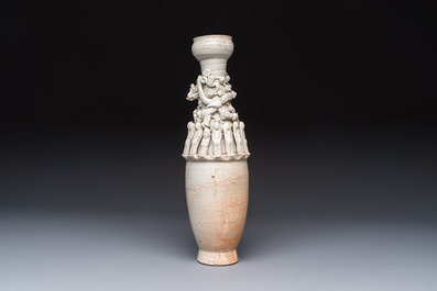 A Chinese qingbai urn applied with immortals and a dragon, Northern Song