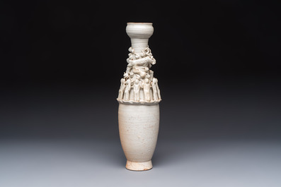 A Chinese qingbai urn applied with immortals and a dragon, Northern Song