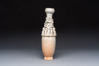 A Chinese qingbai urn applied with immortals and a dragon, Northern Song