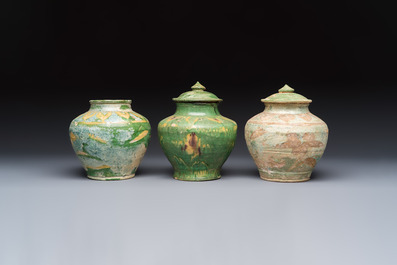 Three Chinese sancai-glazed pottery jars, two with cover, Ming or earlier