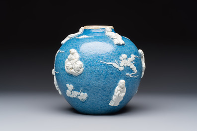 A Chinese sgraffiato blue-ground 'Luohan' vase with relief design, 19th C.