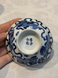 A Chinese blue and white 'Buddhist Lion' teapot, covered bowl and a saucer, various marks, 19th C.