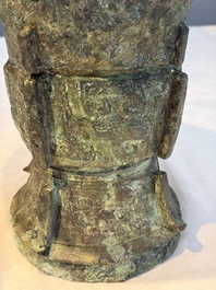 A Chinese archaic bronze ritual wine vessel with Taotie design, 'Zun 尊', Shang