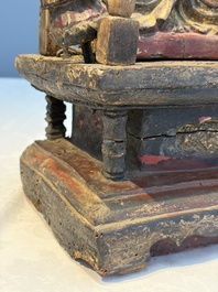 A Chinese gilt-lacquered wooden Bodhisattva and attendants on a throne, Qing