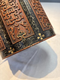 A Chinese gilt black-lacquered huanghuali brush pot with chilong design, Kangxi/Yongzheng