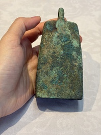 Seven various Chinese bronze and cast-iron bells, Han and later