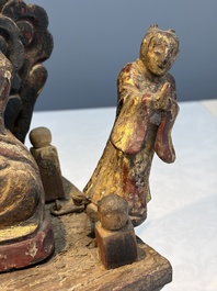 A Chinese gilt-lacquered wooden Bodhisattva and attendants on a throne, Qing
