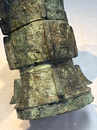 A Chinese archaic bronze ritual wine vessel with Taotie design, 'Zun 尊', Shang