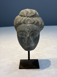 A Gandhara grey schist relief fragment of a Bodhisattva head, 3rd/4th C.