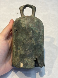 Seven various Chinese bronze and cast-iron bells, Han and later
