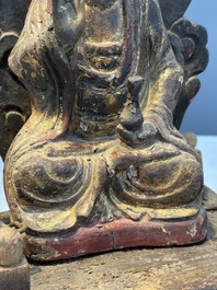 A Chinese gilt-lacquered wooden Bodhisattva and attendants on a throne, Qing