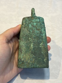 Seven various Chinese bronze and cast-iron bells, Han and later