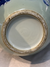 A Chinese blue and white celadon-ground 'Sanxing' bottle vase with relief design, 19th C.