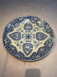 A large Chinese blue and white dish with floral design, Kangxi