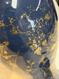 A Chinese gilt-decorated powder-blue-ground 'Phoenix among Blossoming Branches' vase, Qianlong