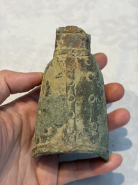 Seven various Chinese bronze and cast-iron bells, Han and later