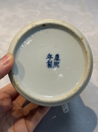 A Chinese blue and white 'Buddhist Lion' teapot, covered bowl and a saucer, various marks, 19th C.