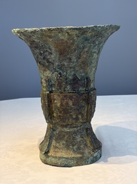 A Chinese archaic bronze ritual wine vessel with Taotie design, 'Zun 尊', Shang