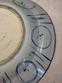 A very large Chinese blue and white 'Kraak' dish with geese by the water, Wanli