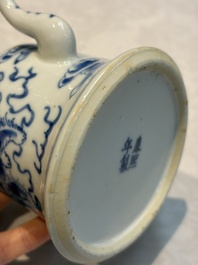 A Chinese blue and white 'Buddhist Lion' teapot, covered bowl and a saucer, various marks, 19th C.