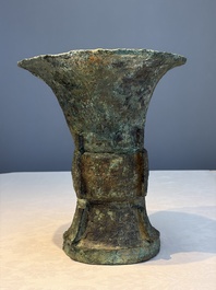 A Chinese archaic bronze ritual wine vessel with Taotie design, 'Zun 尊', Shang