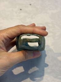 Seven various Chinese bronze and cast-iron bells, Han and later