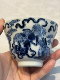 A Chinese blue and white 'Buddhist Lion' teapot, covered bowl and a saucer, various marks, 19th C.