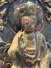 A Chinese gilt-lacquered wooden Bodhisattva and attendants on a throne, Qing