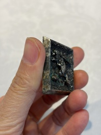 A small Chinese metal-alloy square mirror with relief design, Tang