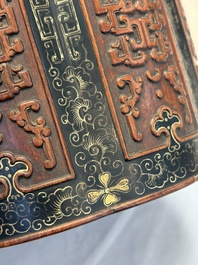 A Chinese gilt black-lacquered huanghuali brush pot with chilong design, Kangxi/Yongzheng