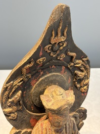 A Chinese gilt-lacquered wooden Bodhisattva and attendants on a throne, Qing