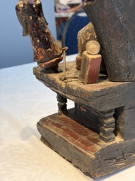 A Chinese gilt-lacquered wooden Bodhisattva and attendants on a throne, Qing